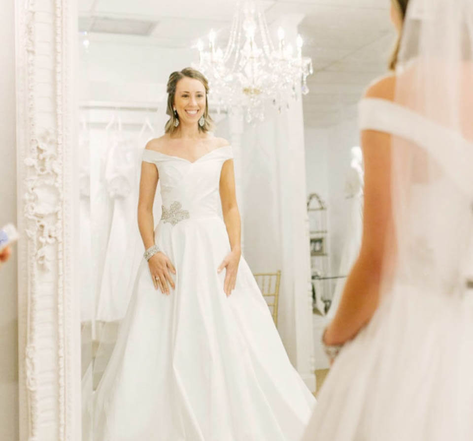 Model wearing a white gown