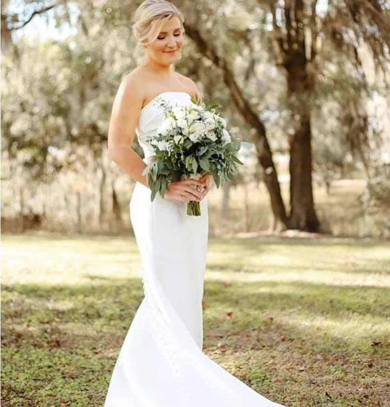 Model wearing a white gown